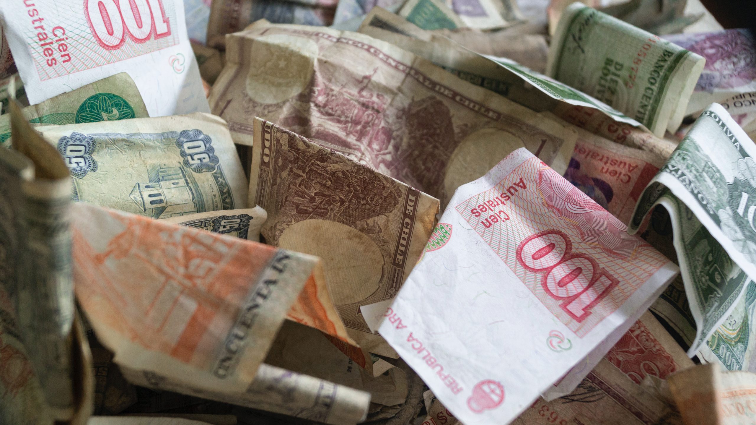many currency notes crumpled together